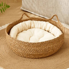 Woven seagrass pet bed with cream cushion, ideal for cats and dogs in cozy home settings