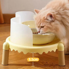 Fluffy cat eating from elevated yellow pet bowl with 5.5cm height, ideal for comfortable feeding.
