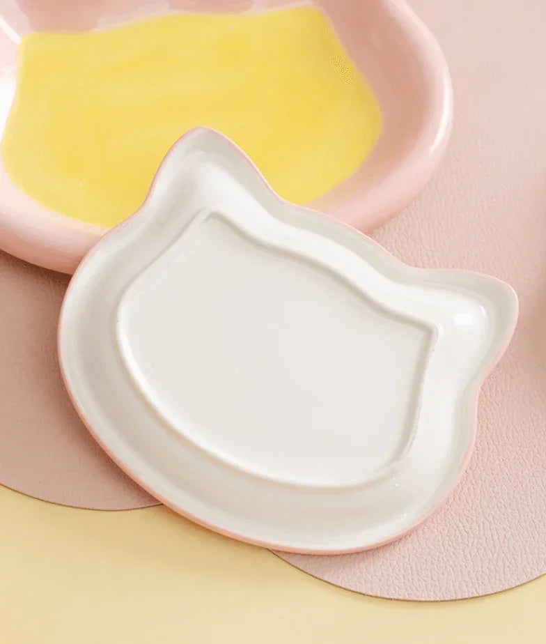 Cute cat-shaped ceramic pet bowl in white and pink, perfect for stylish dog or cat feeding at home.