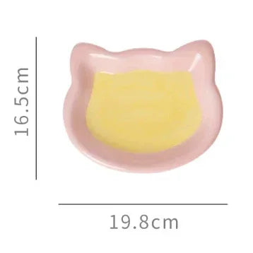 Pink cat-shaped pet bowl with yellow interior, 19.8cm wide, ideal for cats and small dogs