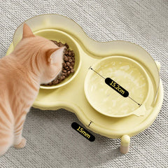 Cat eating from elevated double bowl feeder with 15.2cm diameter, 15mm raised base for comfortable feeding