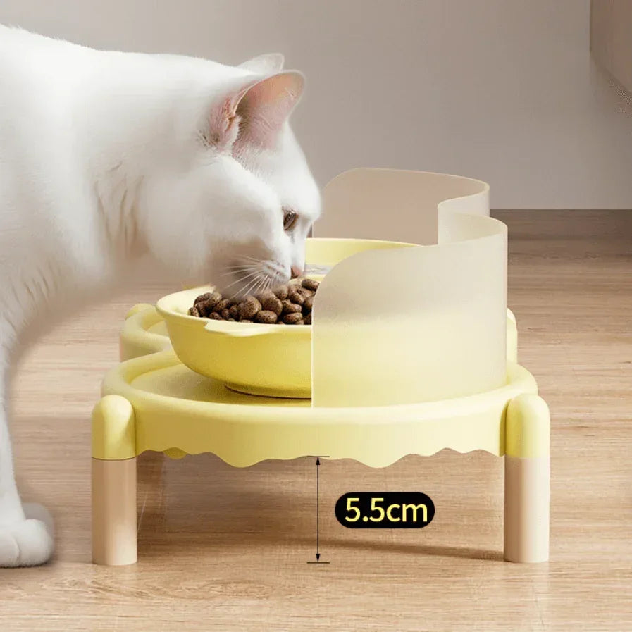 White cat eating from elevated yellow cat food bowl on 5.5cm raised stand, ideal for comfortable feeding.