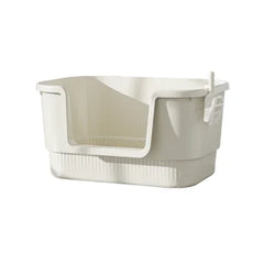 Cream cat litter box with high sides and integrated scoop holder for easy cleanup