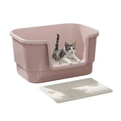 Pink covered cat litter box with tabby cat inside, includes litter mat for mess control