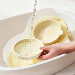 Pet water bowl being filled with fresh water for cats and dogs