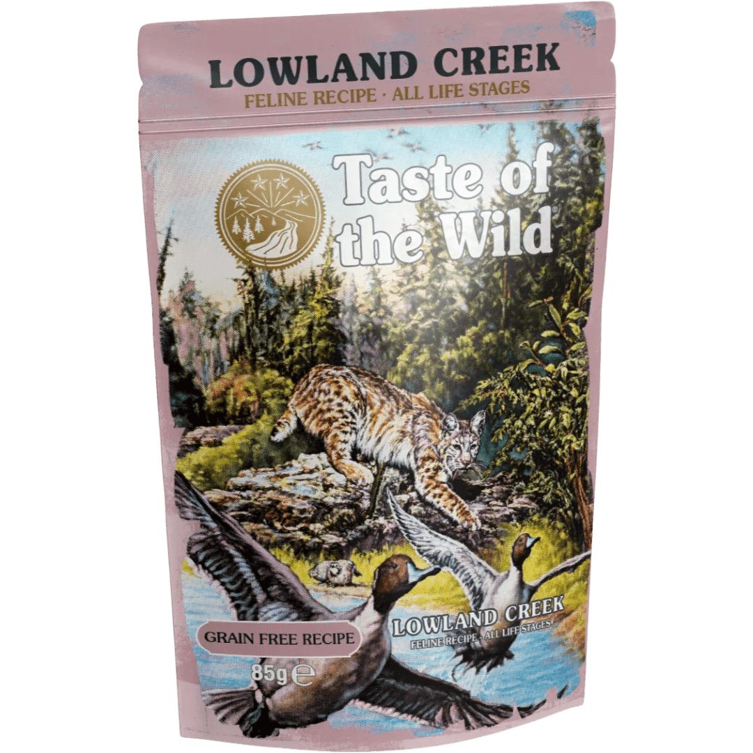 Taste of the Wild Grain-Free Lowland Creek Feline Recipe - Chunks in Gravy 85g x 12 Pack packaging with wildlife scene.