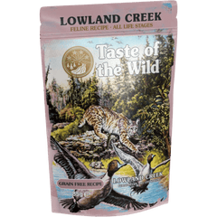 Taste of the Wild Grain-Free Lowland Creek Feline Recipe - Chunks in Gravy 85g x 12 Pack packaging with wildlife scene.