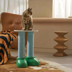 Cat perched on stylish blue and green scratching post in cozy living room