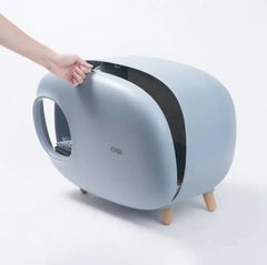 Modern gray cat litter box with wooden legs, sleek design, easy-access lid for pet care