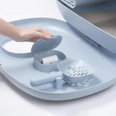 Modern cat litter box with built-in scoop and waste bag dispenser, ideal for clean pet care