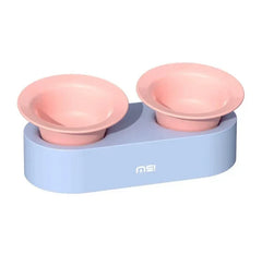 Pastel pink pet bowls on light blue elevated stand for cats or dogs