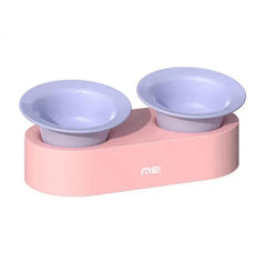 Pink pet feeder with two purple bowls for cats and dogs
