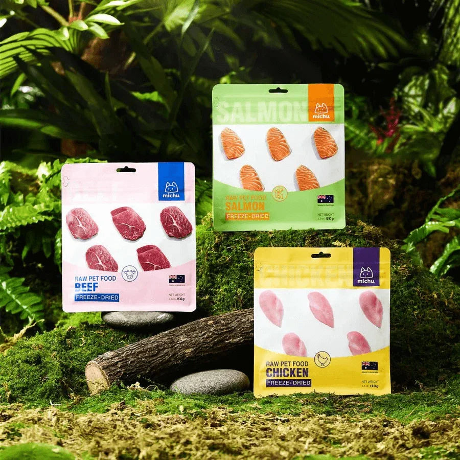 Michu Freeze-Dried Raw Pet Food Dog & Cat Treat 150g - Made in Australia packs displayed among greenery.