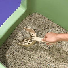 Michu Long-Handle Cat Litter Scoop in use, effectively cleaning cat litter for mess-free maintenance.