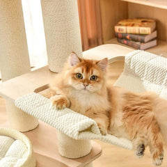 Cat relaxing on the Michu Luna Multi-Layer Solid Wood Cat Nest Tree, showcasing its cozy design.