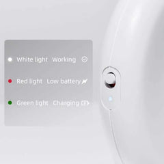 White pet device with indicator lights: white for working, red for low battery, green for charging