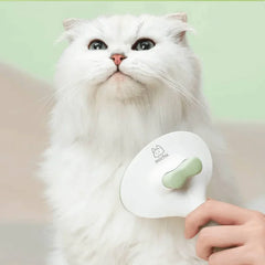 Michu Round-Head Grooming Dog/Cat Brush & Shedding Rake Bundle being used on a fluffy cat.
