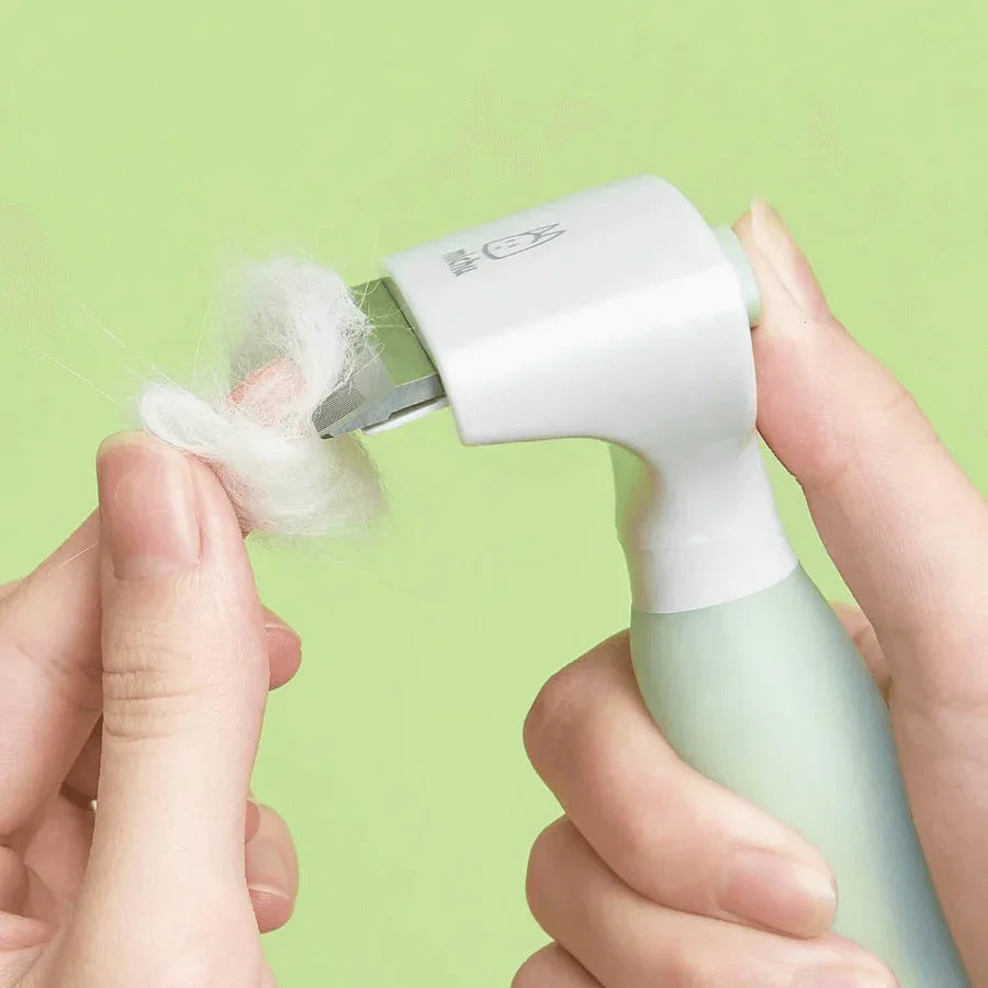 Michu Undercoat Grooming Tool Shedding Rake effectively removing loose pet fur from a gentle grooming brush.