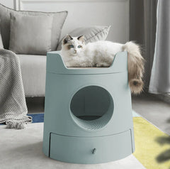 Michu XL Semi Closed Cat Litter Box with Scratch Pad in stylish home setting with cat lounging on top.