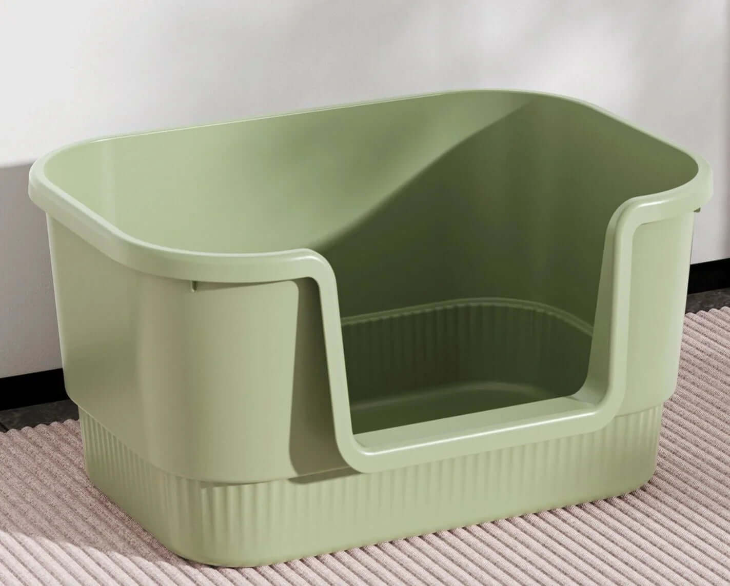 Sage green high-sided cat litter box with entry ramp, ideal for indoor pet care and mess-free use.