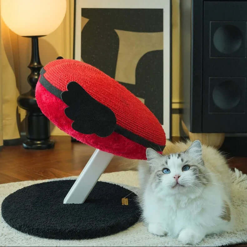 Vertical Heart-Shaped Cat Scratchers with Wings – Durable Natural Sisal Stretching Post with a fluffy cat nearby.