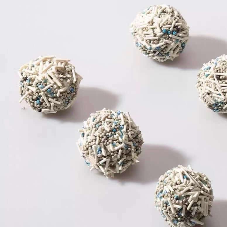 Dog treats with white and blue sprinkles, perfect for pet rewards and training