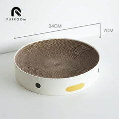 Round cardboard cat scratcher with 34cm diameter, white base, black and yellow dots, ideal for cats to scratch and play.