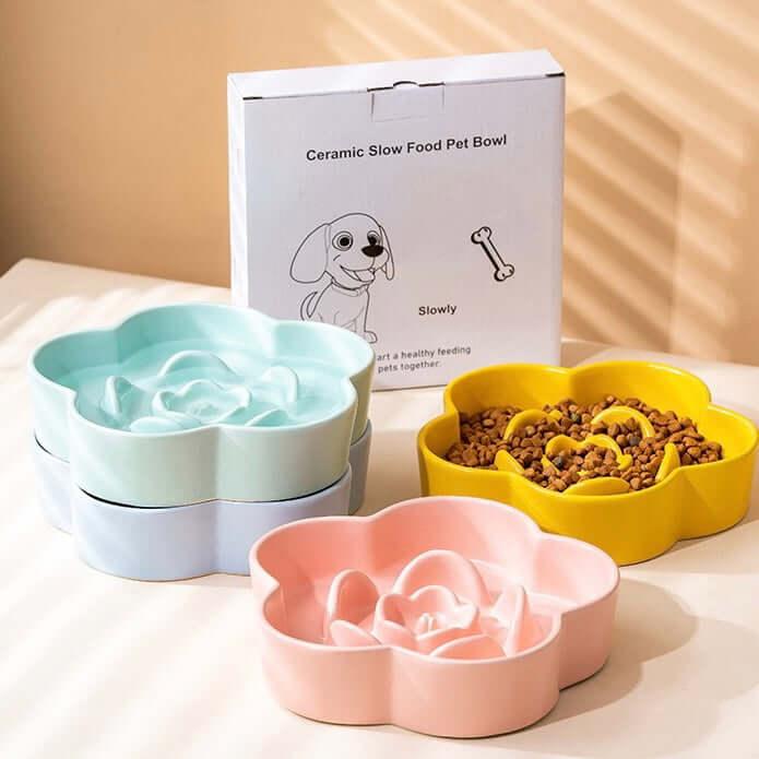 Ceramic slow feed dog bowls in pastel colors, promoting healthy eating for pets