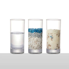 Cat litter types in glasses: water, clumping granules, and absorbed waste for pet hygiene