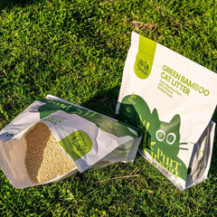 Green Bamboo Cat Litter bags on grass, eco-friendly pet supplies for cats