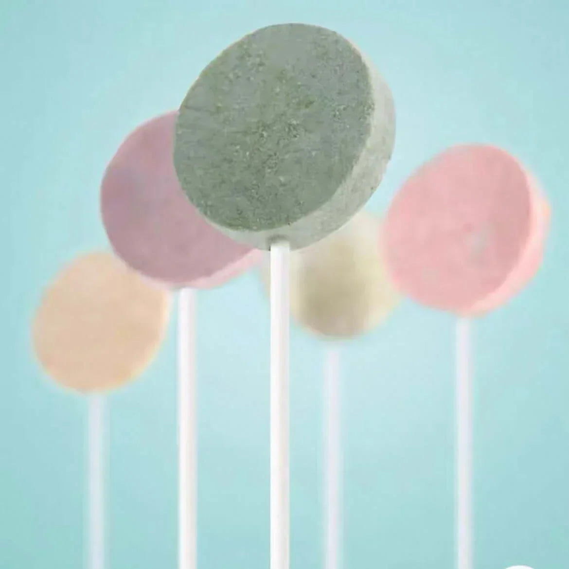 Colorful pet dental chews on sticks for dogs and cats, promoting oral health with tasty flavors.