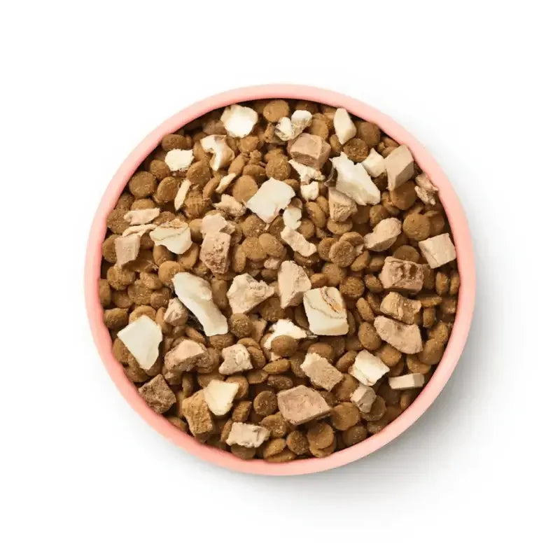 Animals Like Us Freeze Dried Raw Mix 50 Ocean Fish & Chicken Cat Dry Food 1.36kg in a bowl.