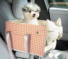 Centre Console Dog Car Seat with Safety Leash & Bow Pillow in a car with a dog inside.