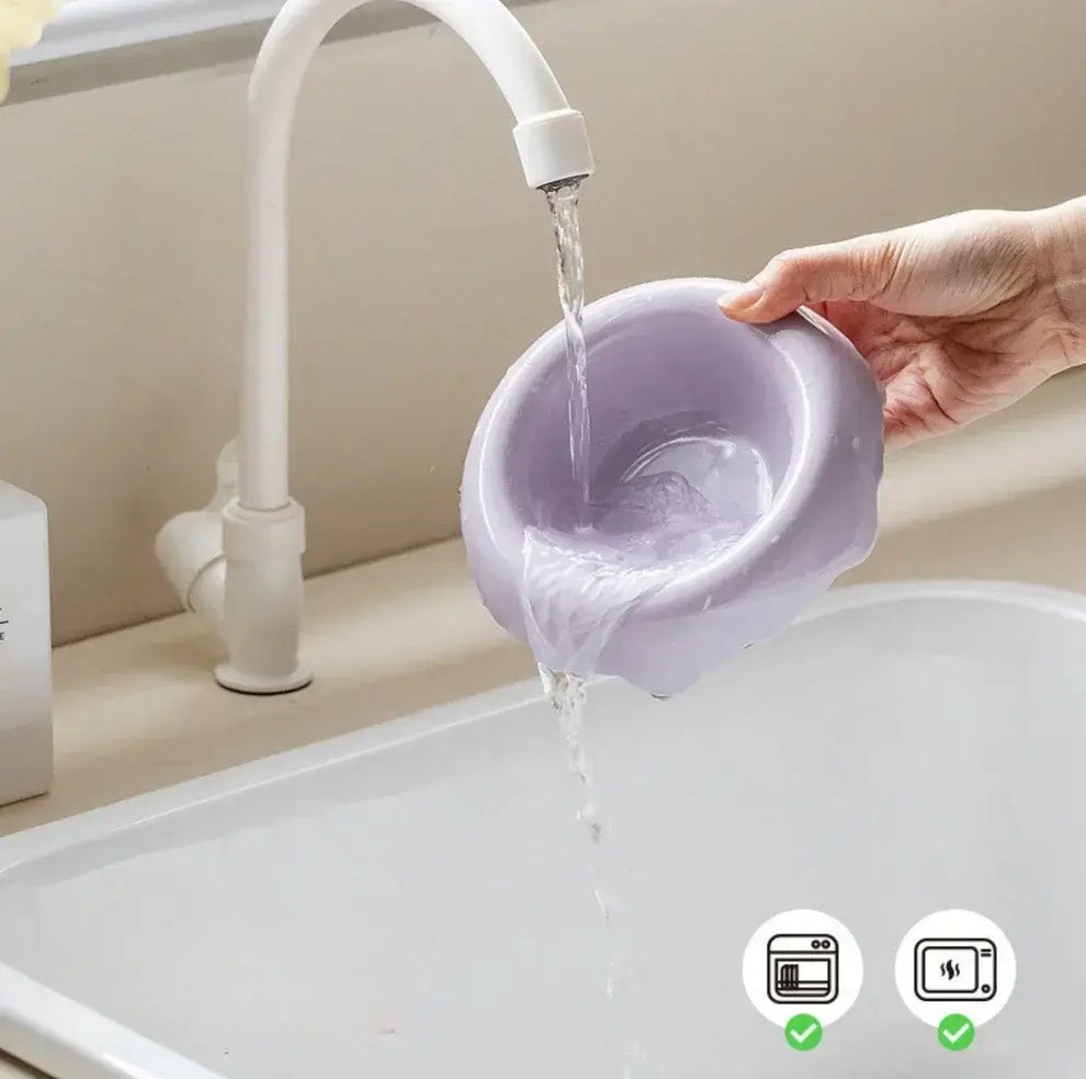 Purple pet bowl being filled with water under faucet, dishwasher and microwave safe