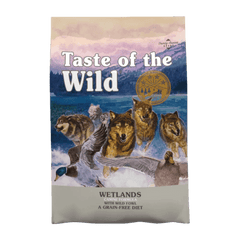 Taste of the Wild Wetlands Canine Grain-Free Dry Dog Food 12.2kg packaging featuring wolves and scenic wetlands.