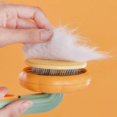 Hand using a pet hair removal tool with collected fur on an orange background