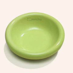 Michu Wide and Shallow Ceramic Pet Bowl in soft green color, designed to prevent whisker fatigue for comfortable feeding.