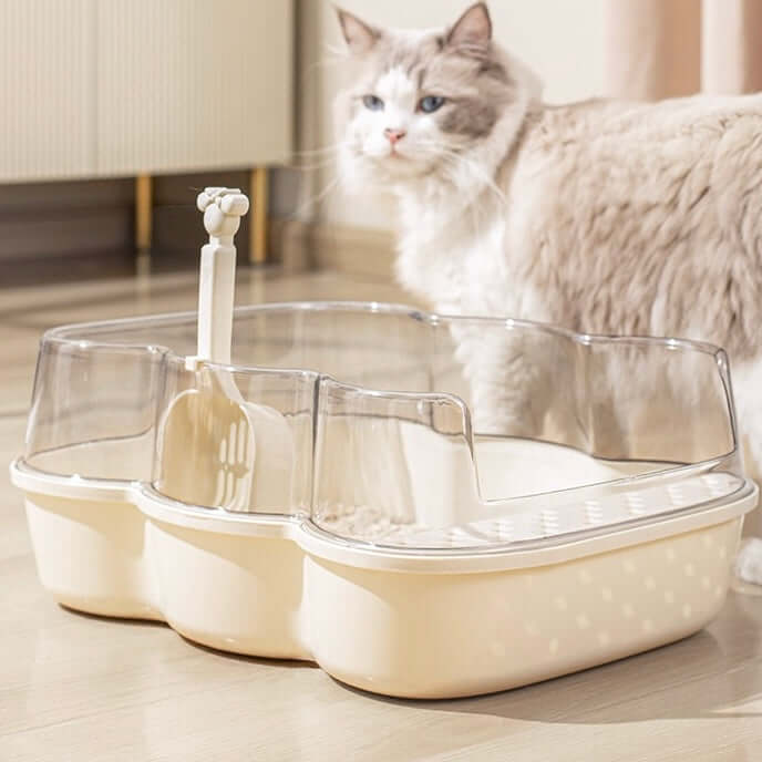Transparent Semi-Enclosed Large Cat Litter Tray with Scoop placed next to a cat in a bright room.