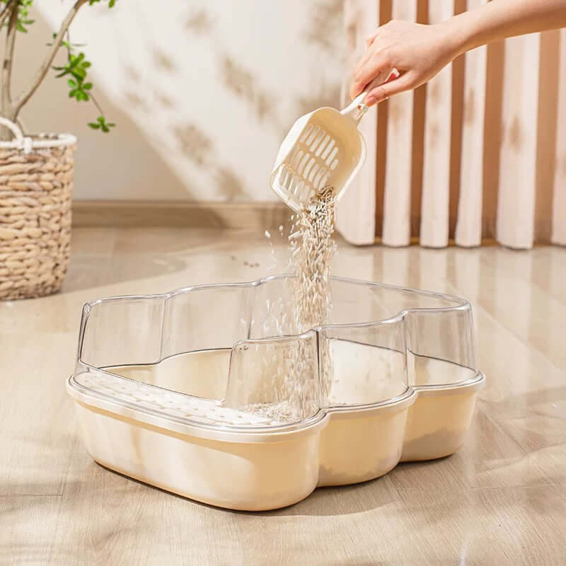 Transparent Semi-Enclosed Large Cat Litter Tray with Scoop being filled with litter for a clean cat environment.