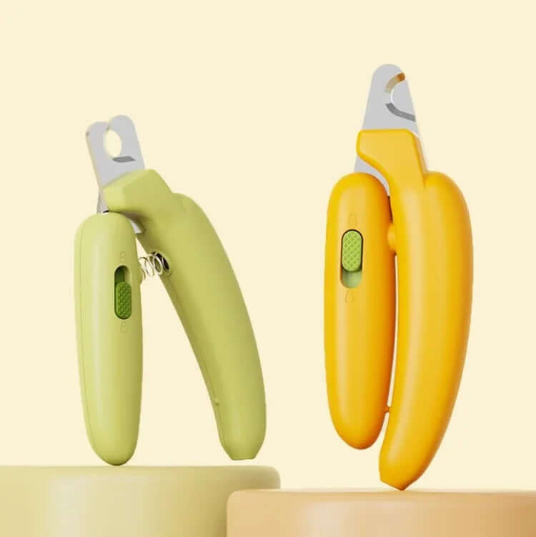 Green and yellow pet nail clippers for cats and dogs, ergonomic design with safety guard