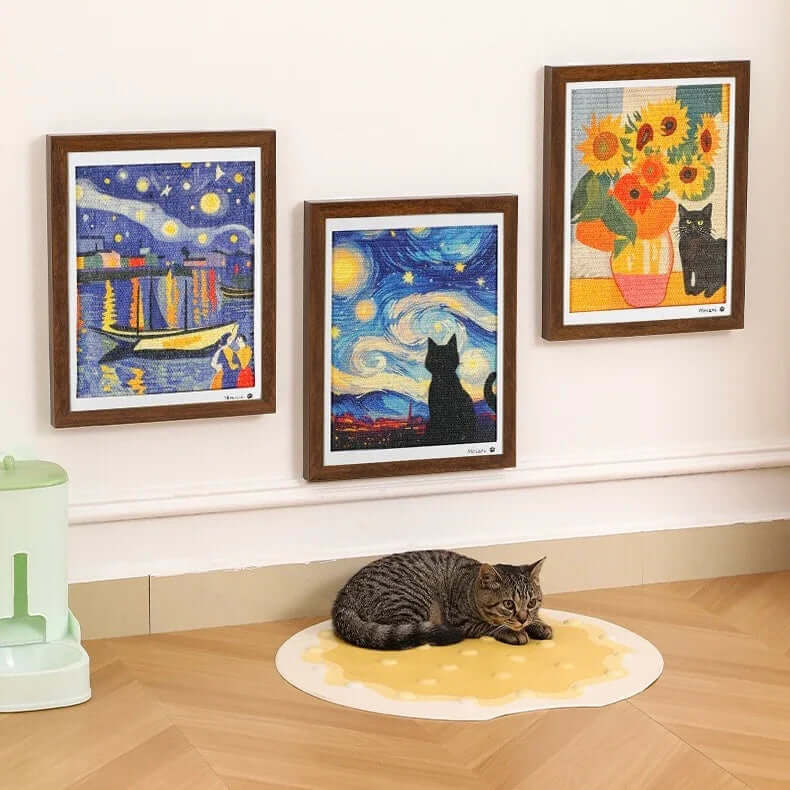 Tabby cat resting on cheese-shaped mat under Van Gogh-style cat art prints, stylish pet decor