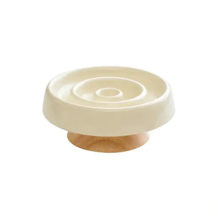 Cream ceramic slow feeder bowl with wooden base for dogs and cats