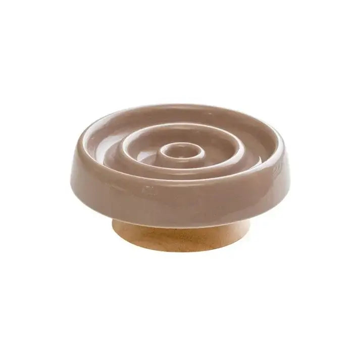 Beige ceramic slow feeder bowl for dogs and cats with wooden base, promoting healthy eating