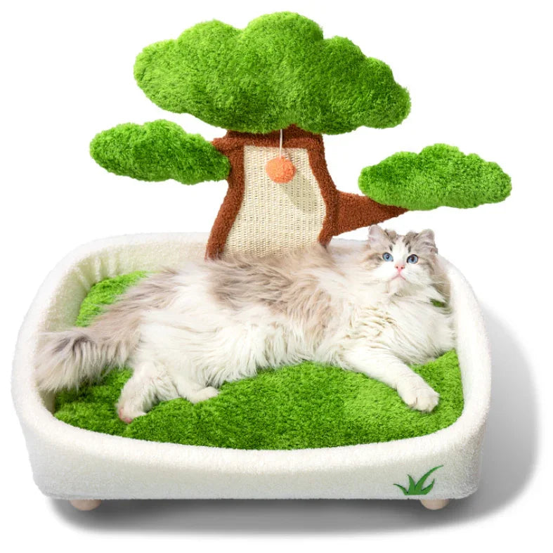 Cat lying on a green-themed pet bed with a tree decoration