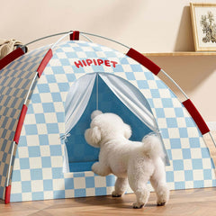 Foldable Indoor Cat & Dog Tent with Cooling Mat 58×58cm featuring a white dog entering the blue-and-white tent.