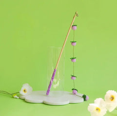 Purple cat wand toy with felt berries and bell, perfect for playful cats and stylish pet supplies.