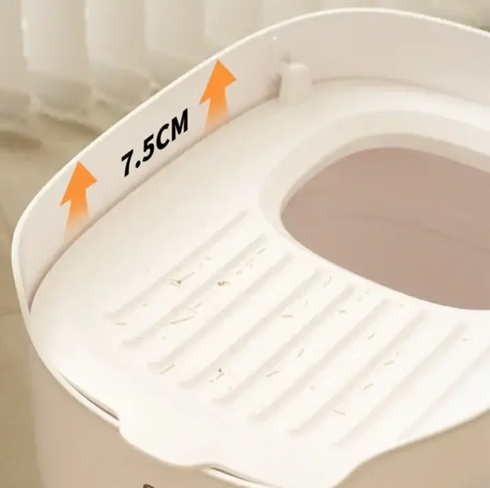 White cat litter box with 7.5cm high rim and slatted design for easy cleaning