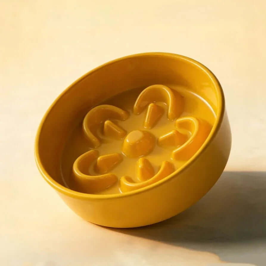 Mustard yellow slow feed dog bowl with flower-shaped ridges for healthy eating