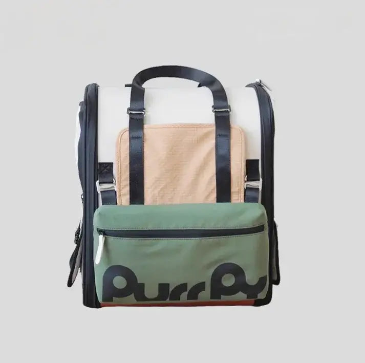 Purr Purr cat carrier backpack with green front pocket, beige mesh panel, and black straps for pet travel